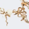 ”abissi” chokerhalsband i metall och raffia, guld ”abissi” chokerhalsband i metall och raffia, guld