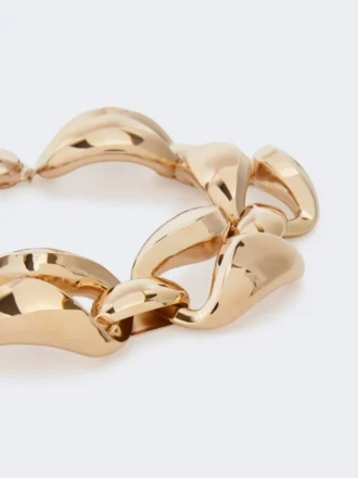 Iögonfallande metallhalsband, brons