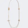 Långt halsband med monogramdetaljer, elfenben Långt halsband med monogramdetaljer, elfenben