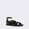 Platta sandaler i läder och elastiskt band, svarta Platta sandaler i läder och elastiskt band, svarta