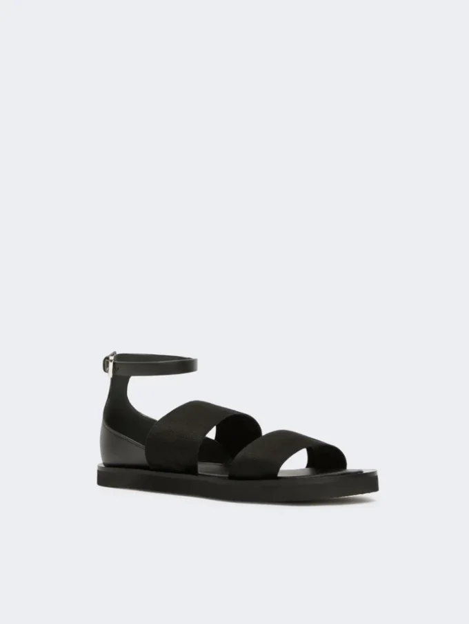 Platta sandaler i läder och elastiskt band, svarta Platta sandaler i läder och elastiskt band, svarta