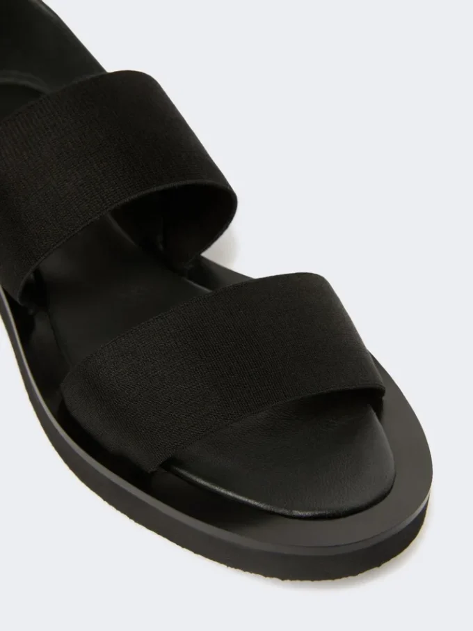 Platta sandaler i läder och elastiskt band, svarta Platta sandaler i läder och elastiskt band, svarta