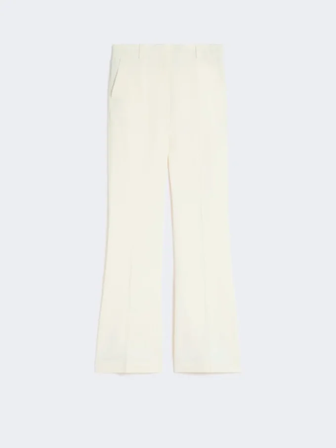 Slim-fit byxor med utsvängda ben i viskos, elfenben Slim-fit byxor med utsvängda ben i viskos, elfenben